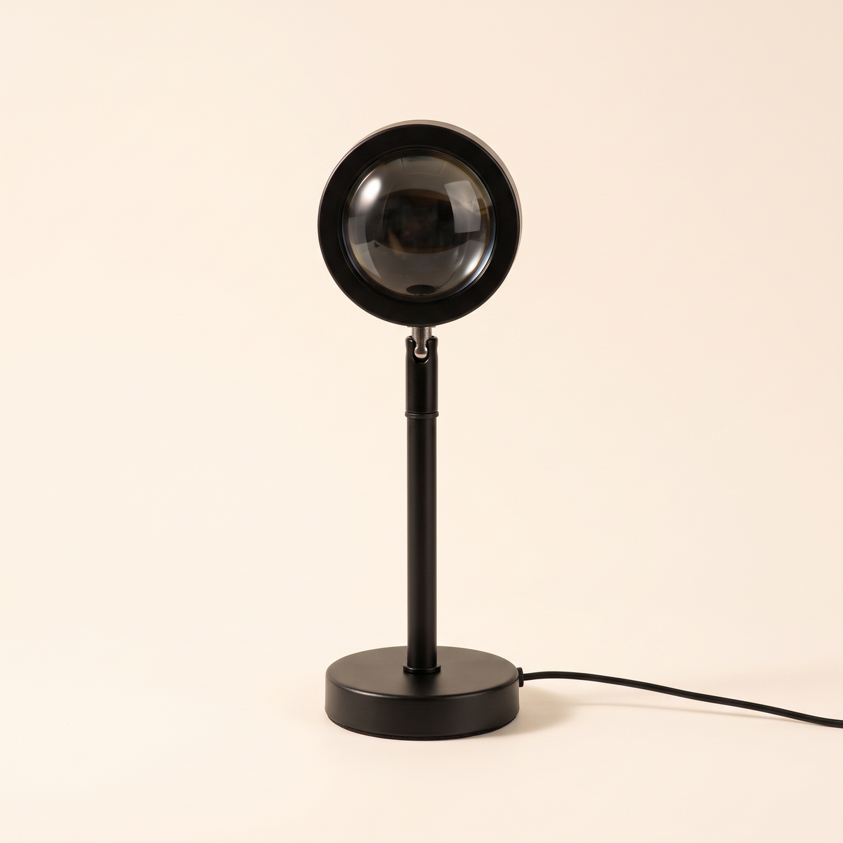 Black sunset projection lamp on a plain background