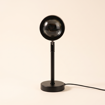 Black sunset projection lamp on a plain background