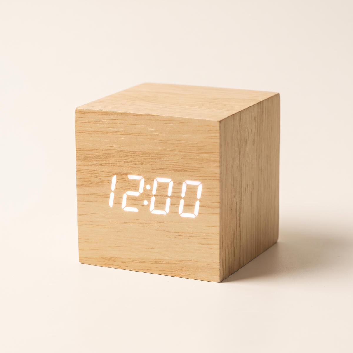 Wooden LED alarm clock on a plain background